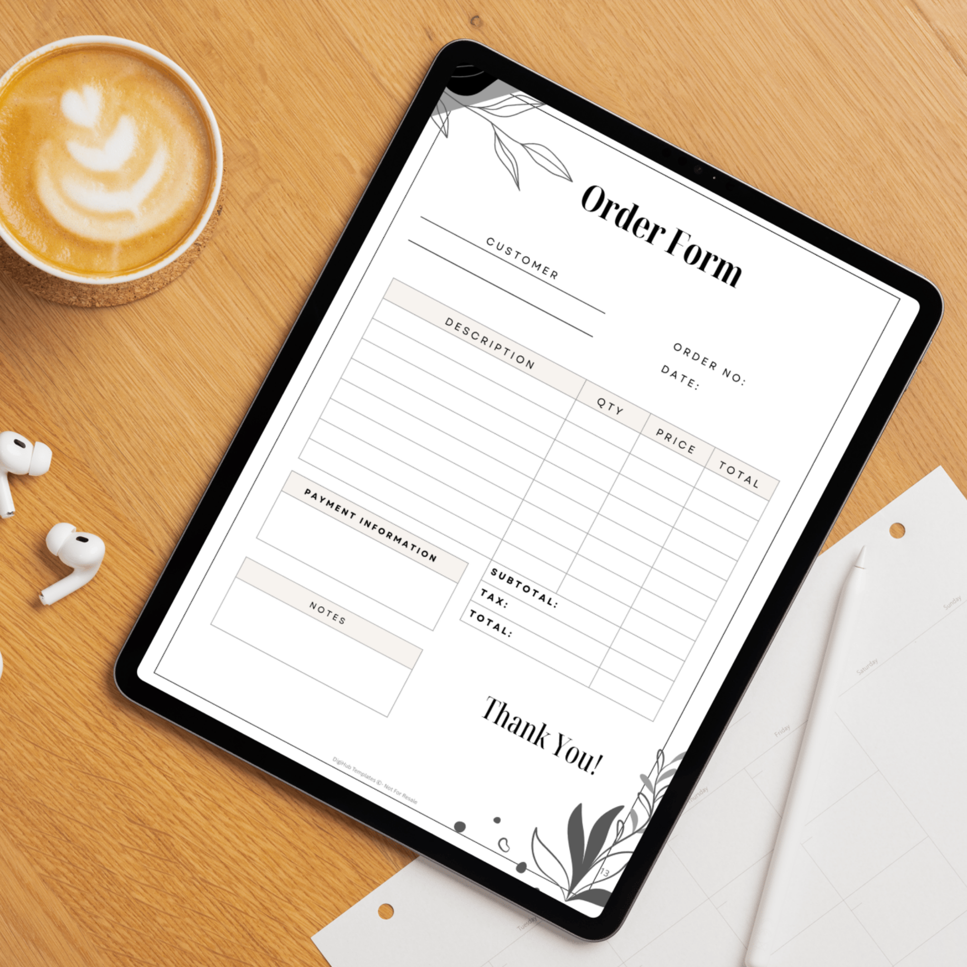Tablet displaying an order form on a wooden surface with a cup of coffee and earbuds.