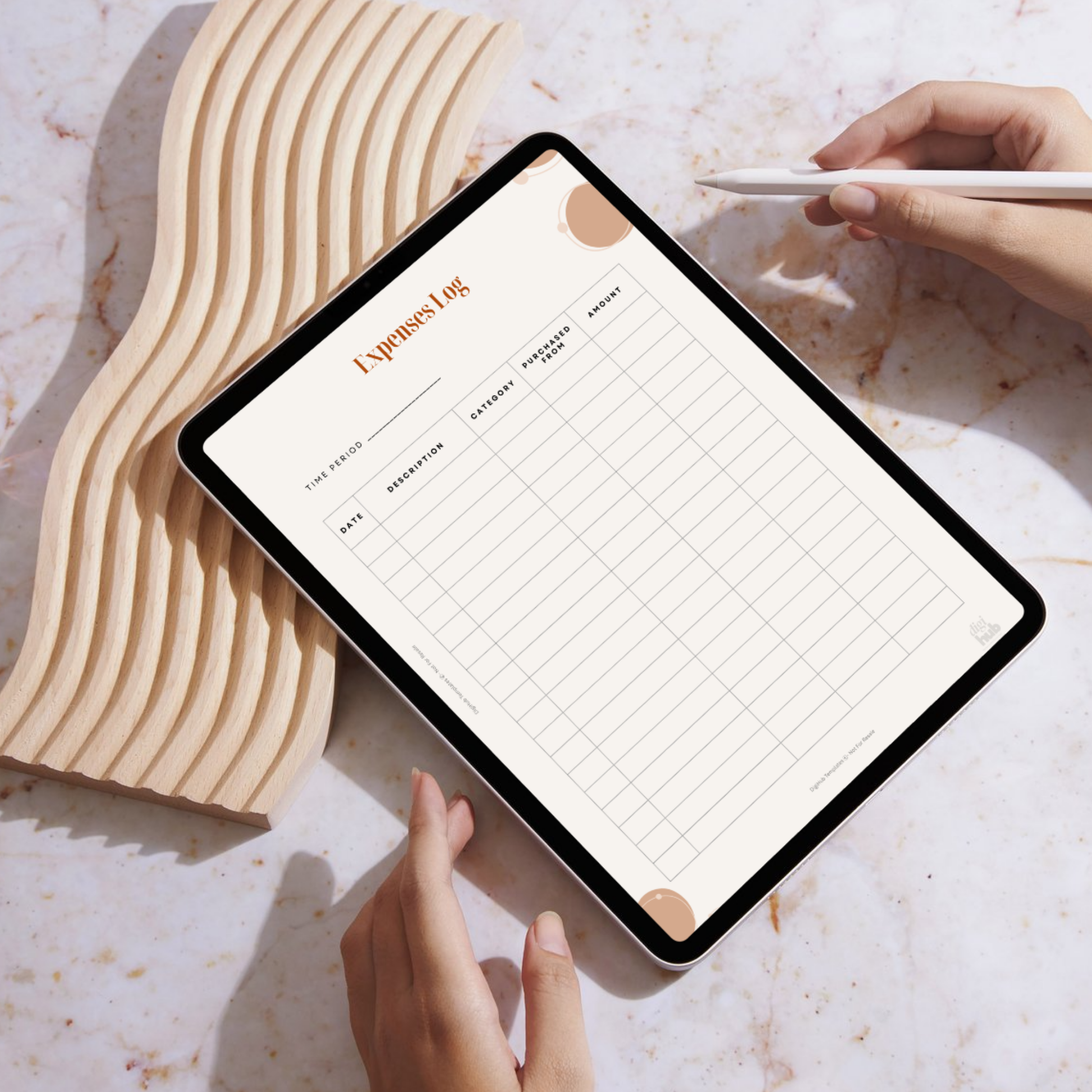 Person using a tablet with an expenses log app on a marble surface