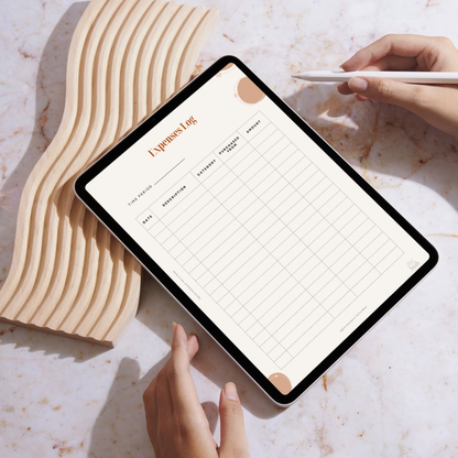 Person using a tablet with an expenses log app on a marble surface
