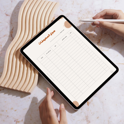Person using a tablet with a to-do list app on a marble surface
