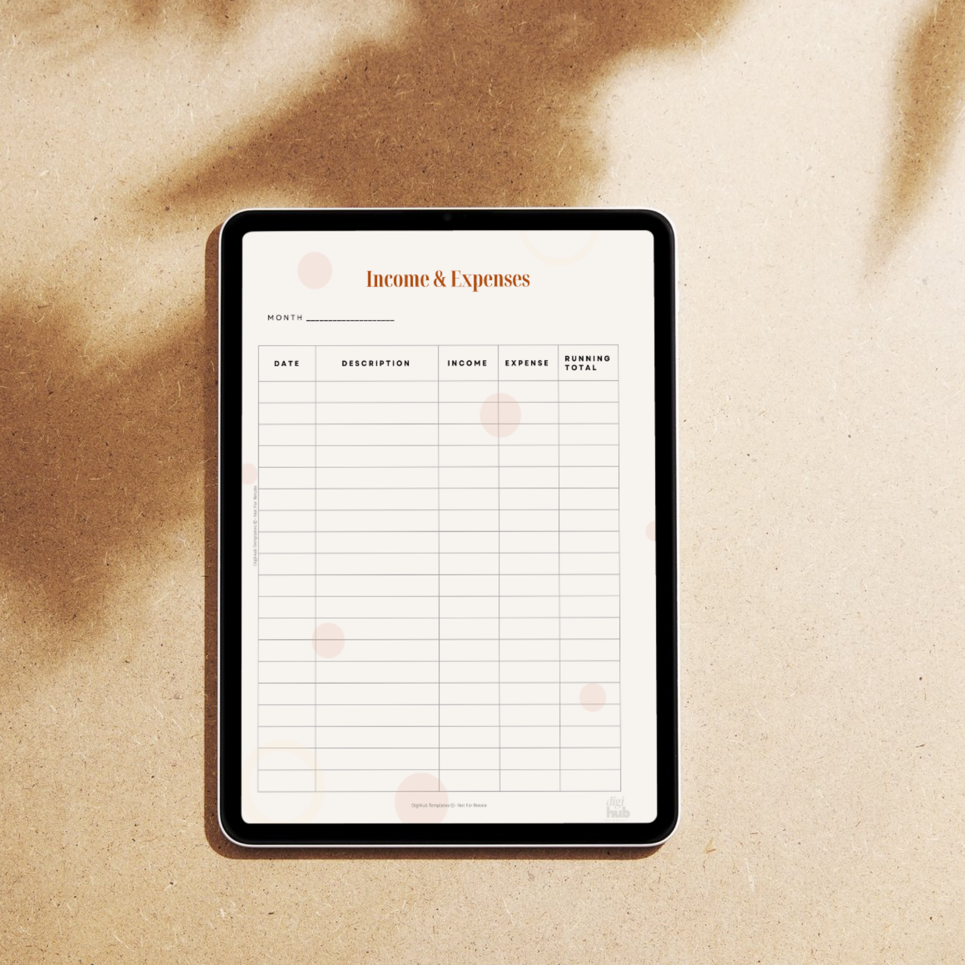 Digital tablet displaying an 'Income & Expenses' spreadsheet on a textured beige surface