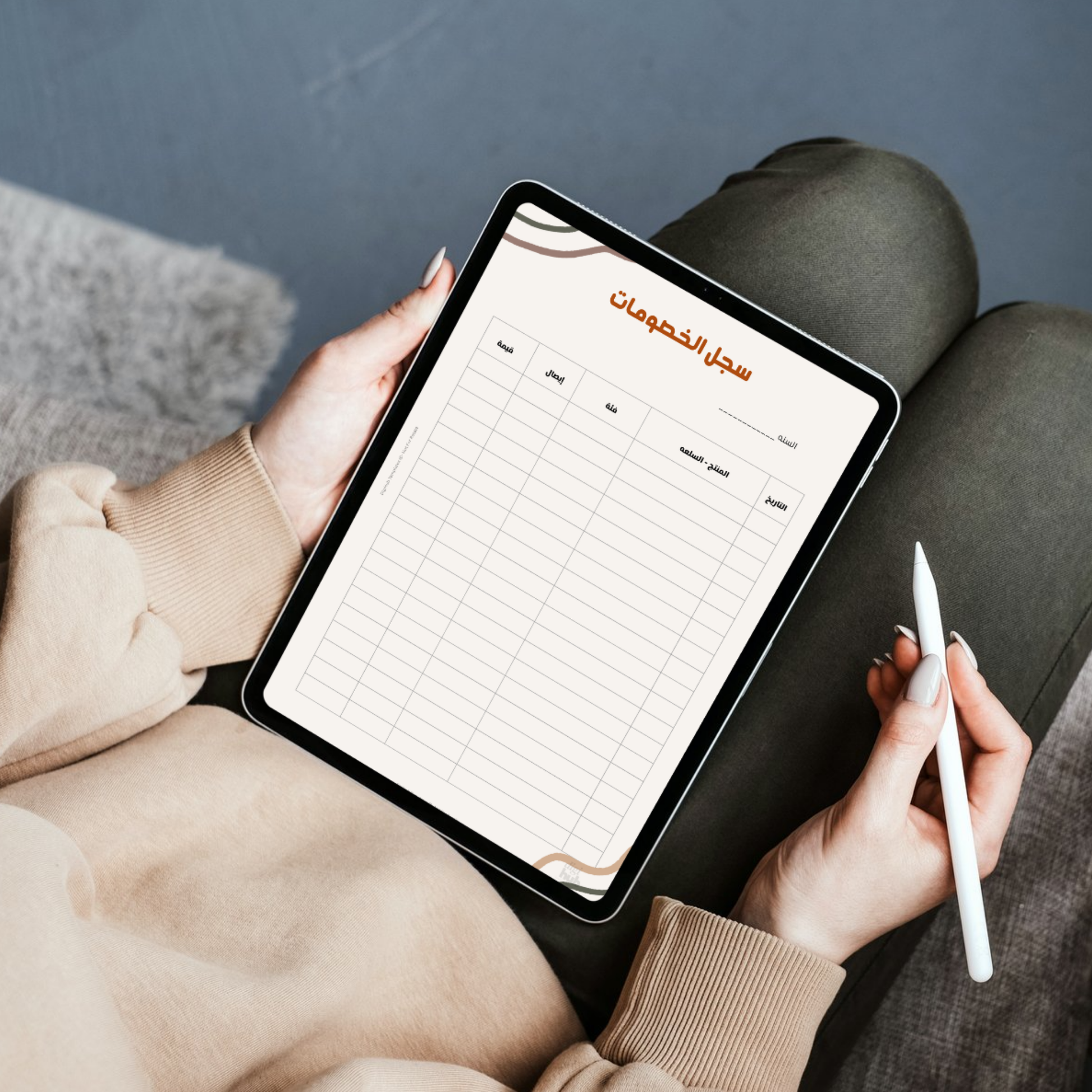 Person holding a tablet with a planner app open on a dark surface