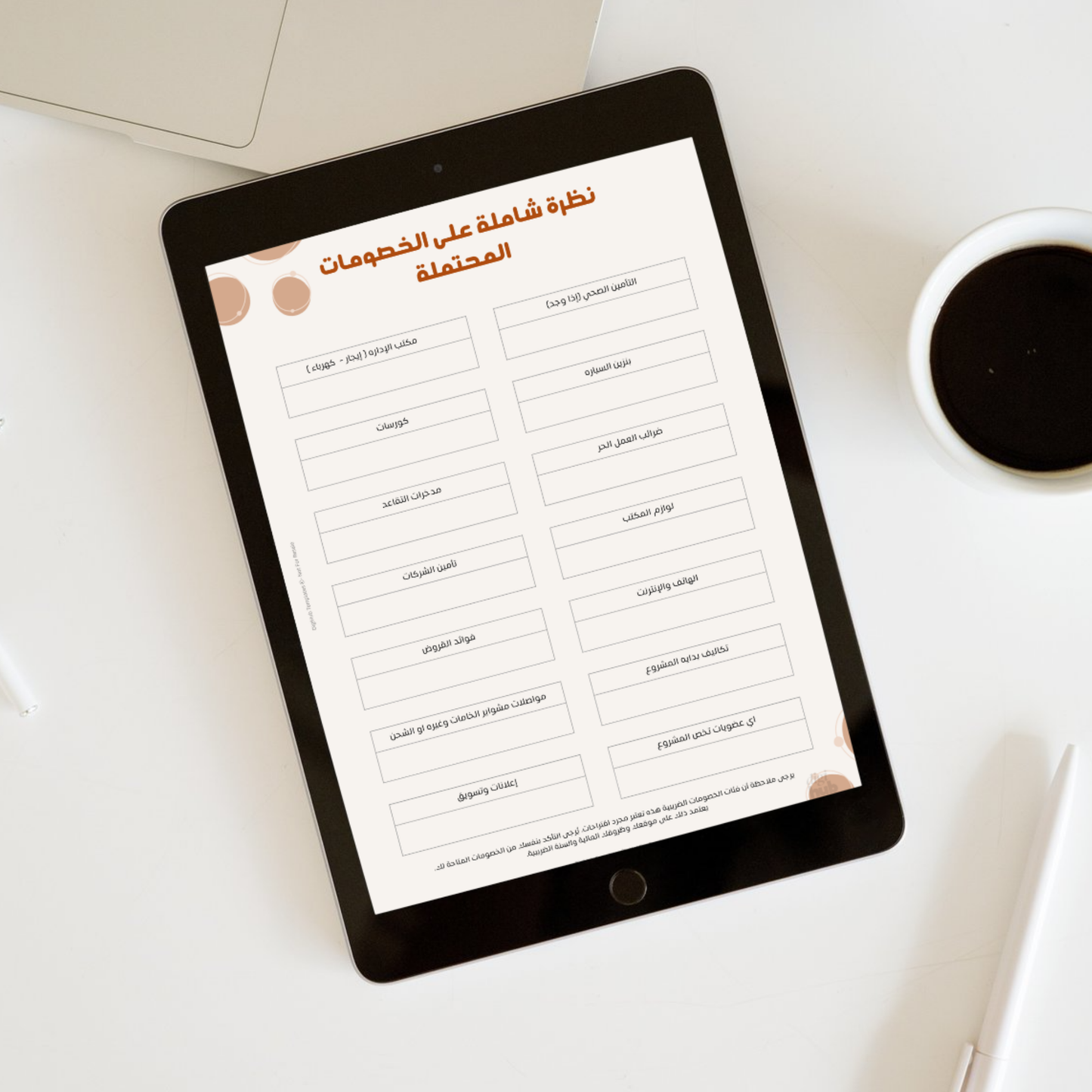 Tablet displaying a document with Arabic text on a white surface with a coffee cup.